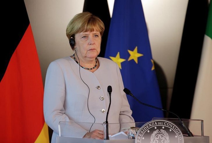 Down but not out, Germany`s Merkel weighs another run